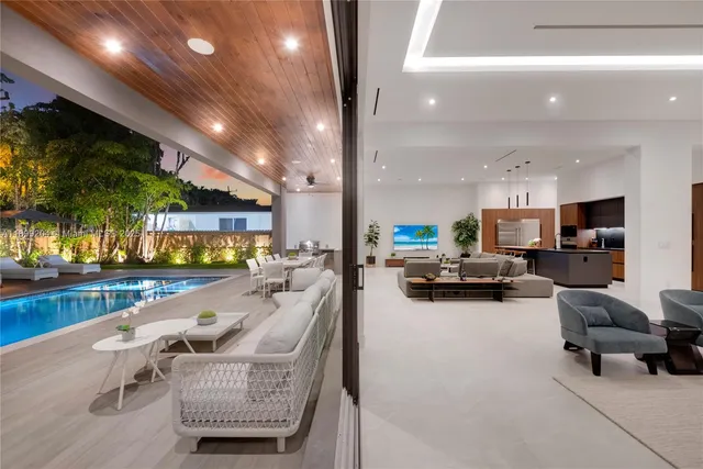 a view of swimming pool with outdoor seating