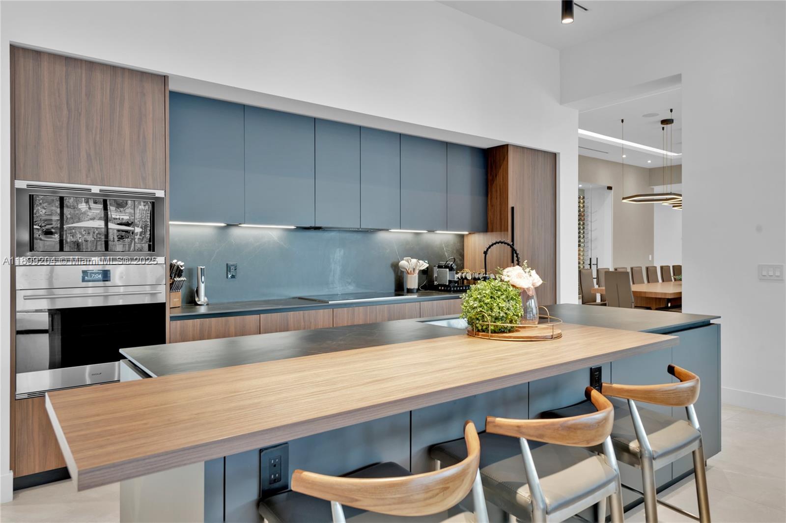 2110 Northeast 197th Terrace Miami, FL 33179 - Photo 16 of 77 a kitchen with a table and chairs in it