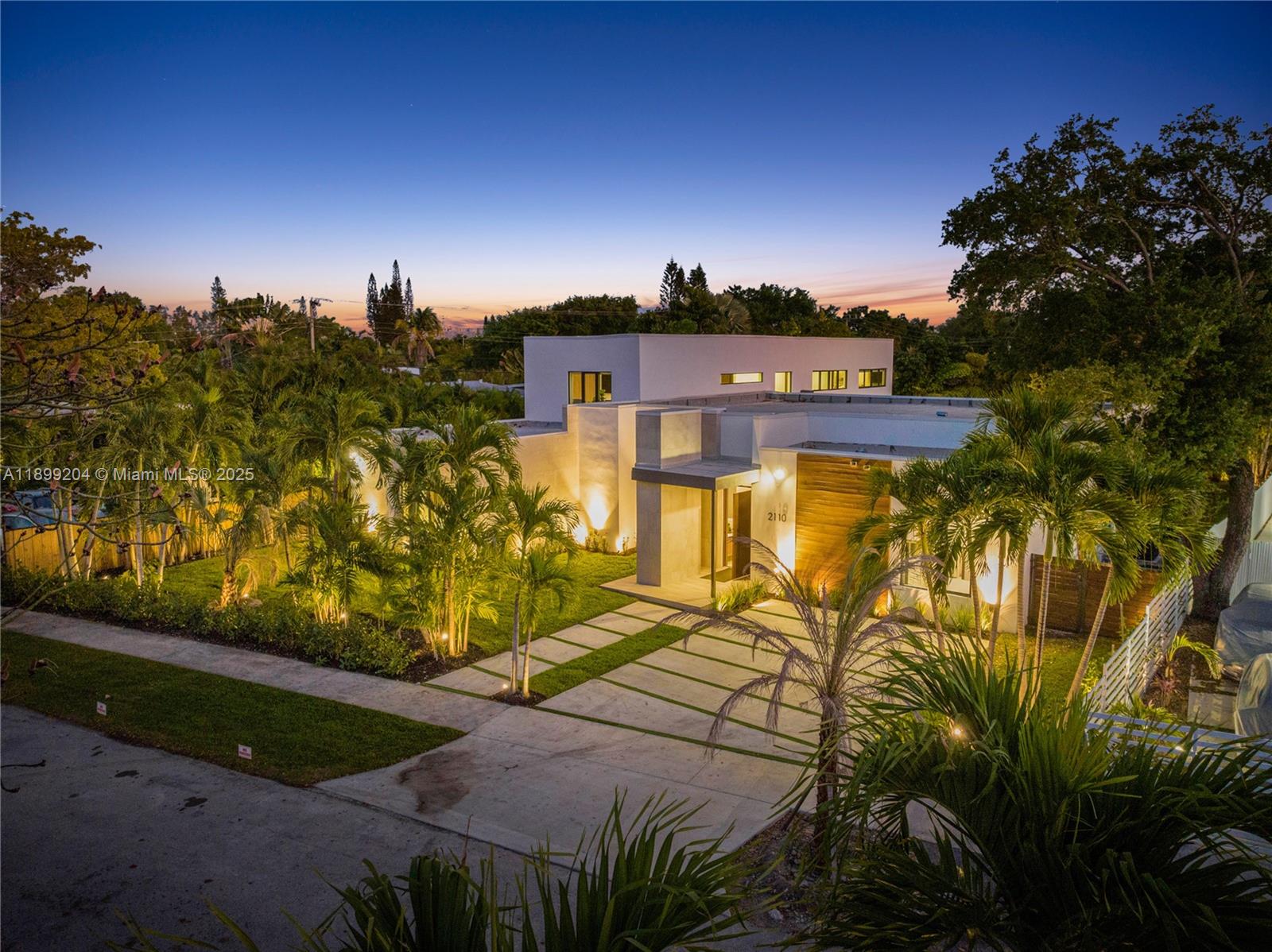 2110 Northeast 197th Terrace Miami, FL 33179 - Photo 2 of 77 a view of a big yard in front of the house