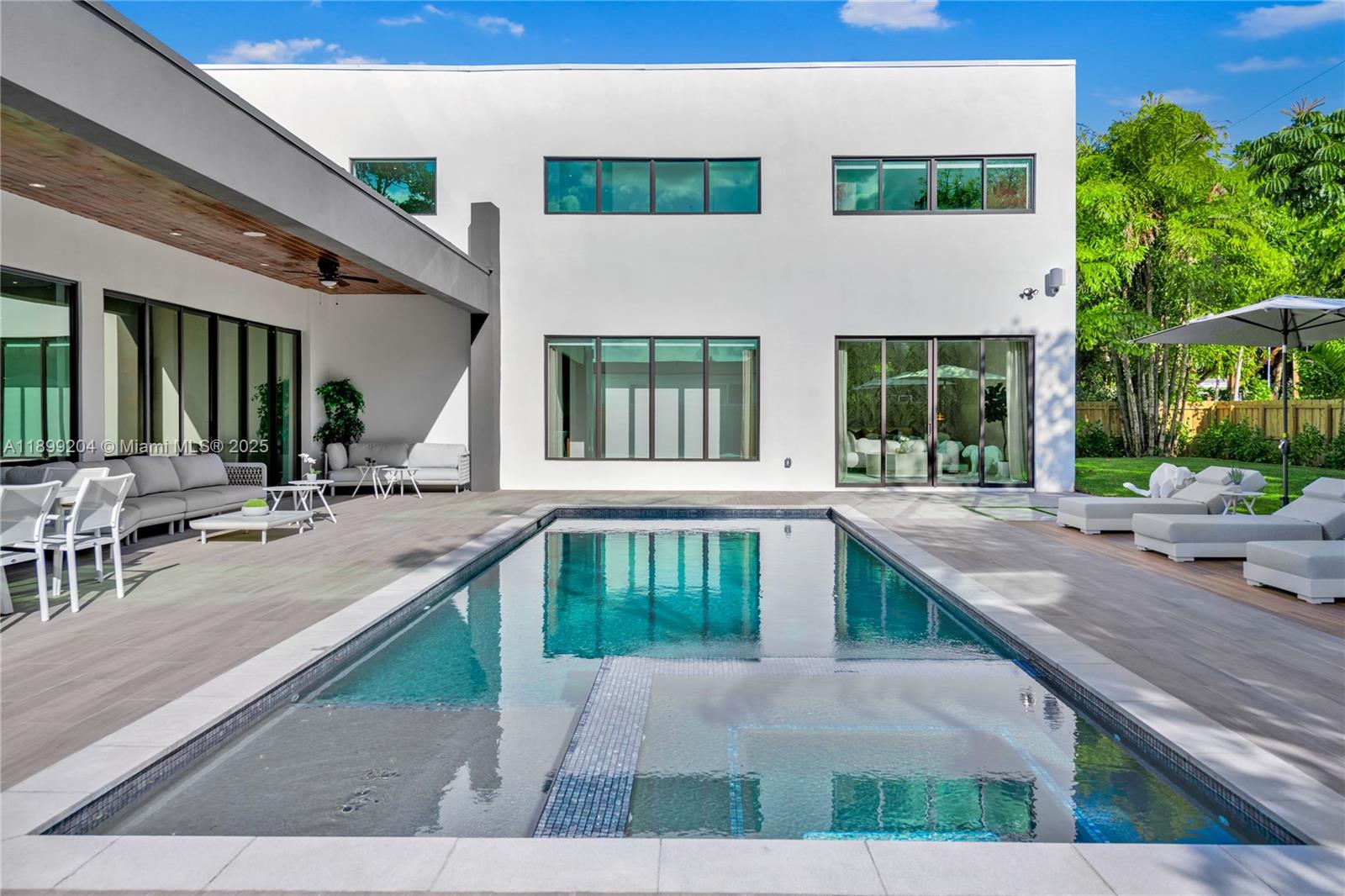 2110 Northeast 197th Terrace Miami, FL 33179 - Photo 23 of 77 a view of swimming pool with outdoor seating