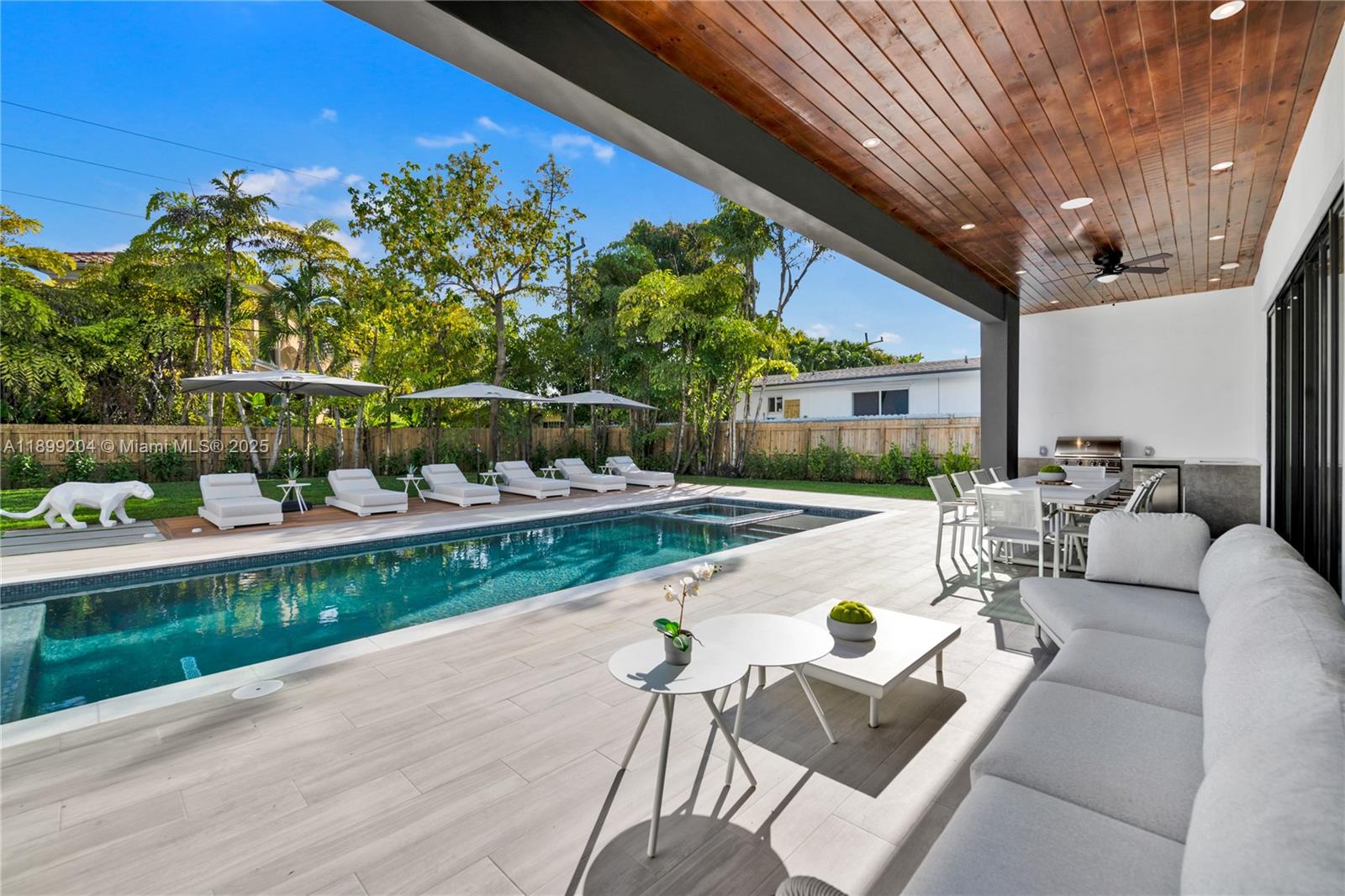 2110 Northeast 197th Terrace Miami, FL 33179 - Photo 28 of 77 a view of swimming pool outdoor seating and city view