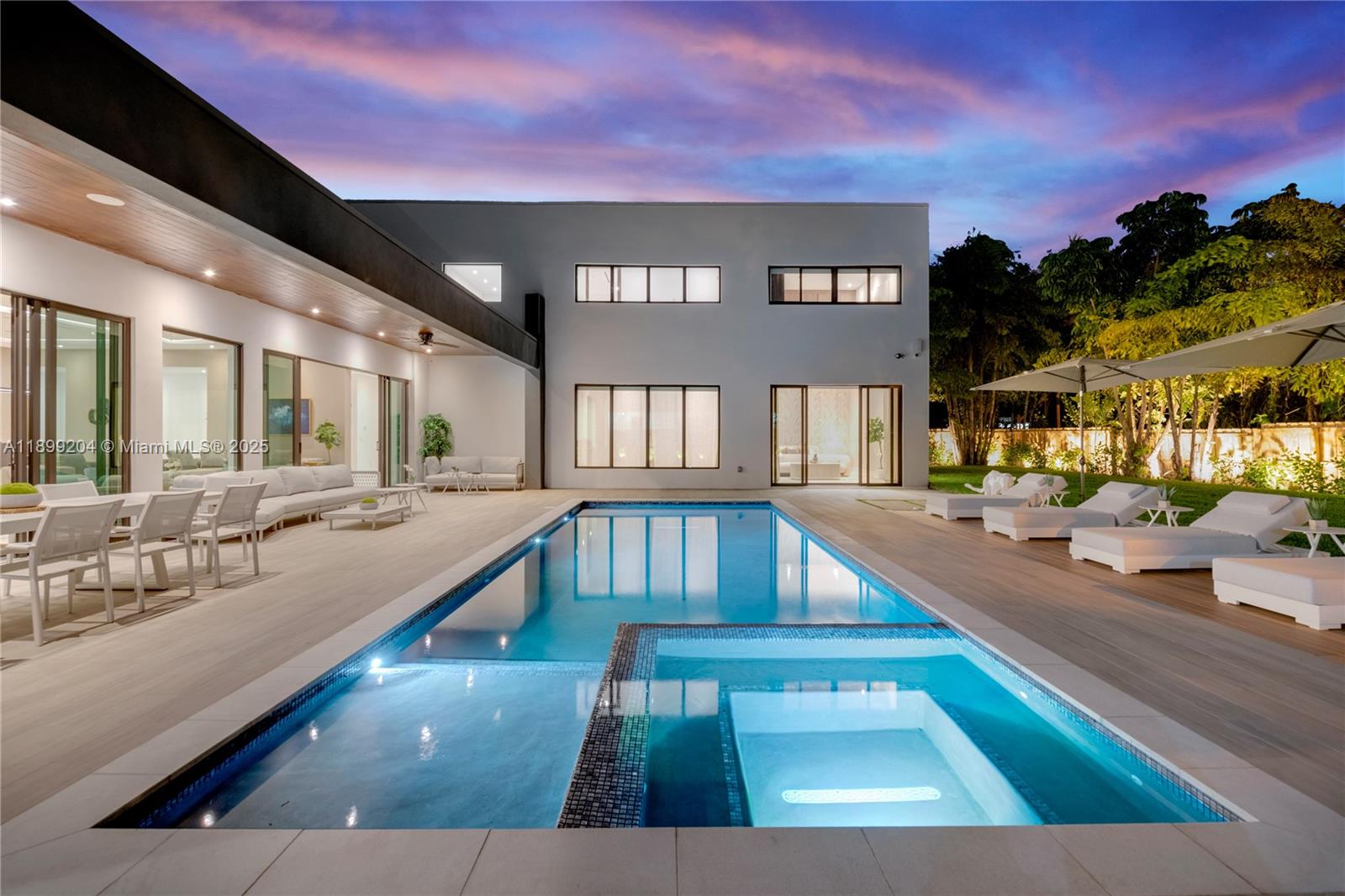 2110 Northeast 197th Terrace Miami, FL 33179 - Photo 3 of 77 a view of swimming pool with outdoor seating