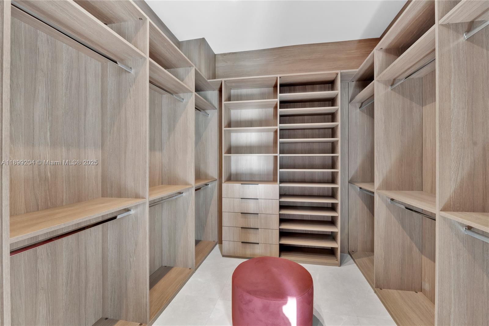 2110 Northeast 197th Terrace Miami, FL 33179 - Photo 38 of 77 a view of walk in closet with empty racks