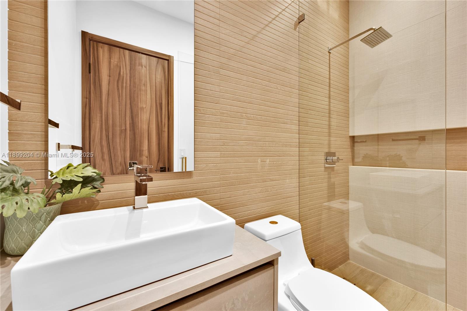 2110 Northeast 197th Terrace Miami, FL 33179 - Photo 52 of 77 a bathroom with a sink a toilet and shower