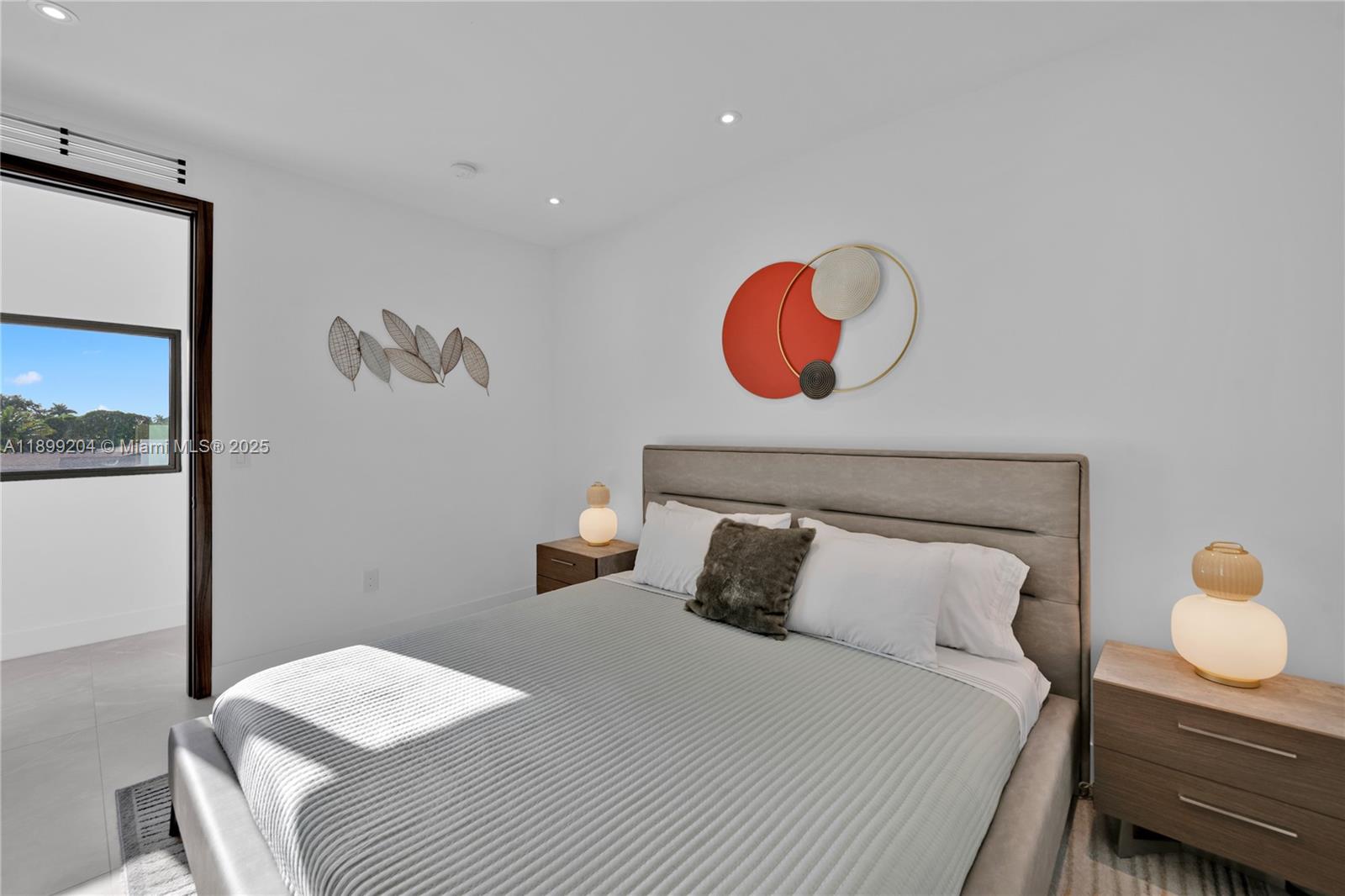 2110 Northeast 197th Terrace Miami, FL 33179 - Photo 58 of 77 a bedroom with a bed and painting on the wall