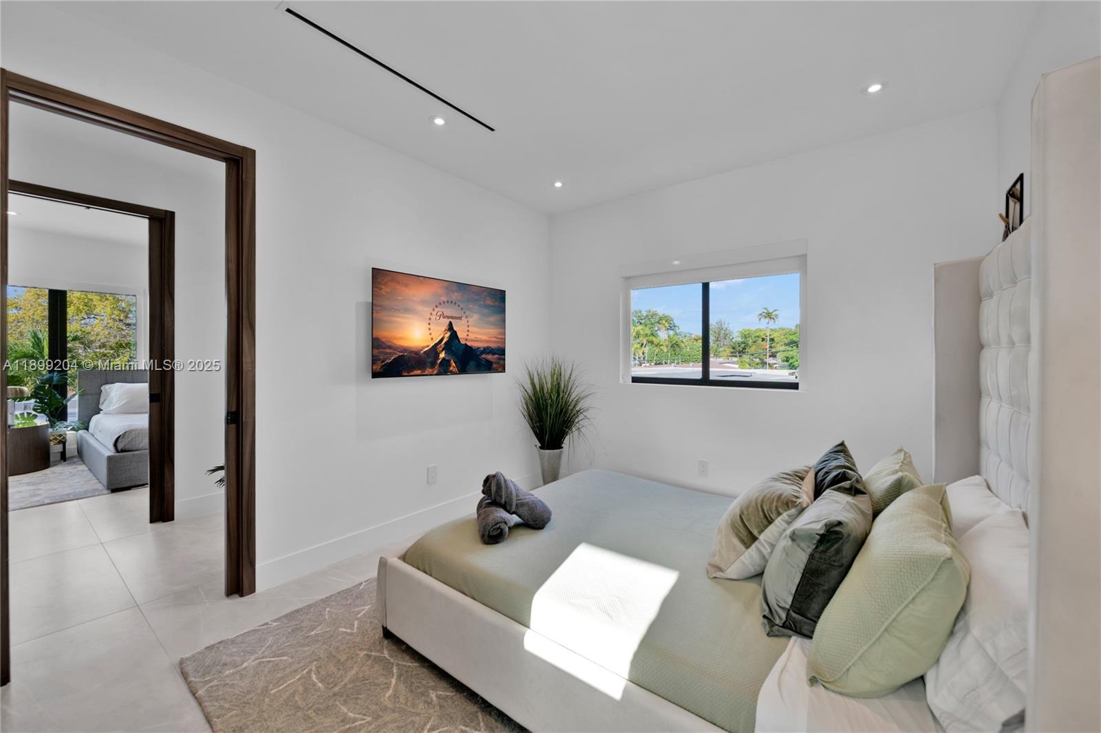 2110 Northeast 197th Terrace Miami, FL 33179 - Photo 60 of 77 a living room with furniture and a flat screen tv