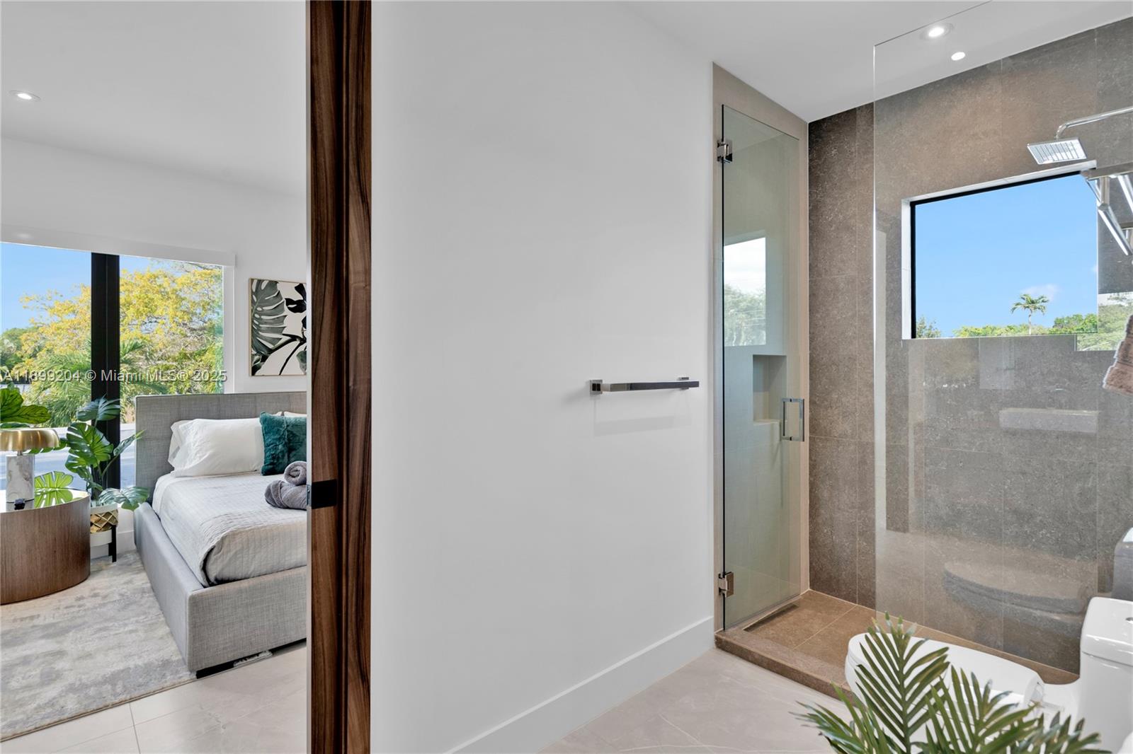 2110 Northeast 197th Terrace Miami, FL 33179 - Photo 62 of 77 a living room with furniture and a floor to ceiling window