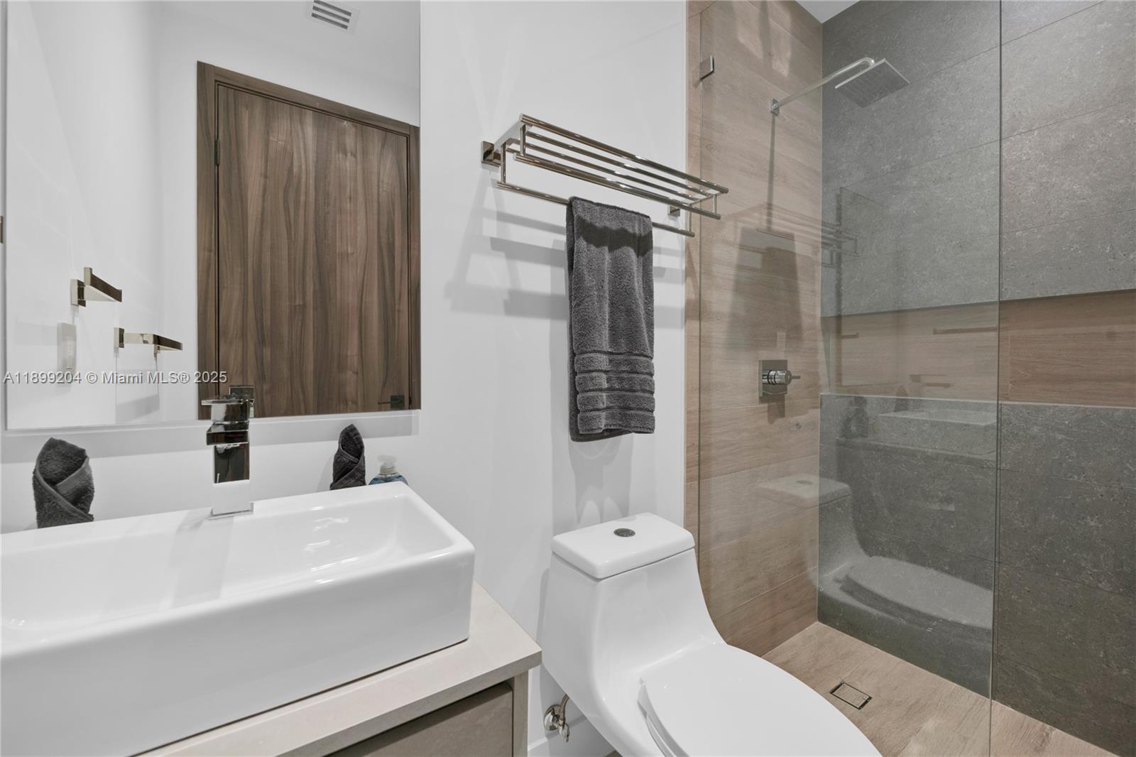 2110 Northeast 197th Terrace Miami, FL 33179 - Photo 68 of 77 a bathroom with a sink toilet and shower