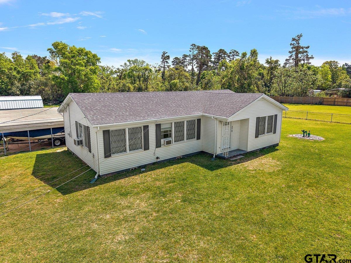279 Fairview Street Rusk, TX 75785 - Photo 1 of 23 a aerial view of a house with a yard table and chairs