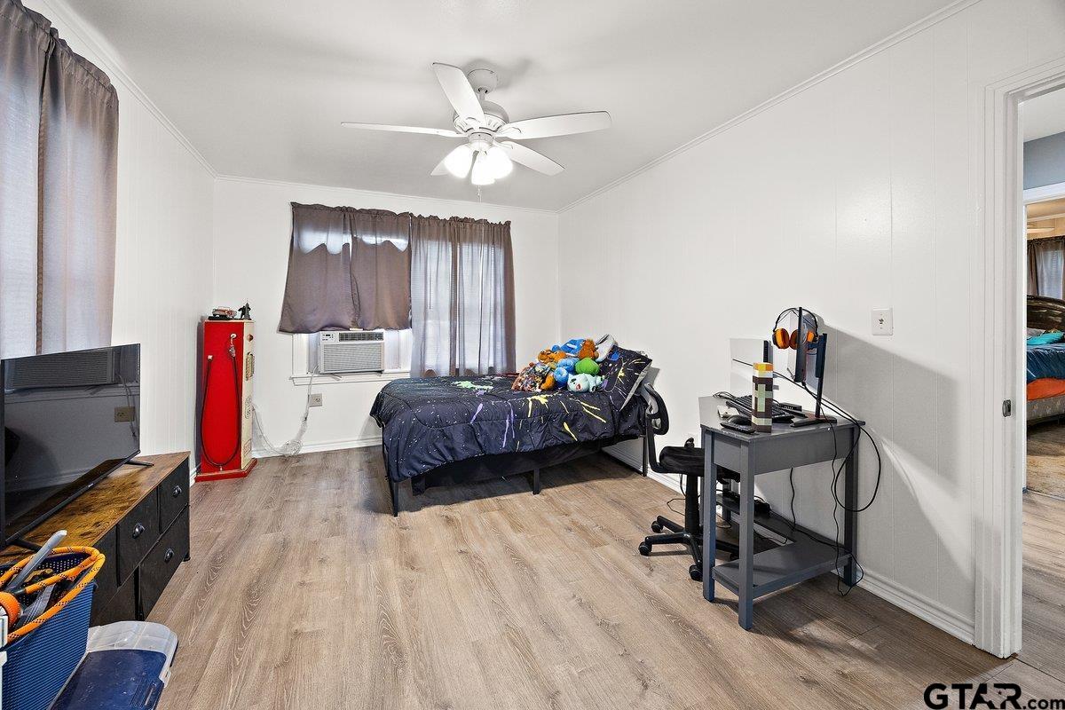 279 Fairview Street Rusk, TX 75785 - Photo 11 of 23 a bedroom with a bed and a flat screen tv