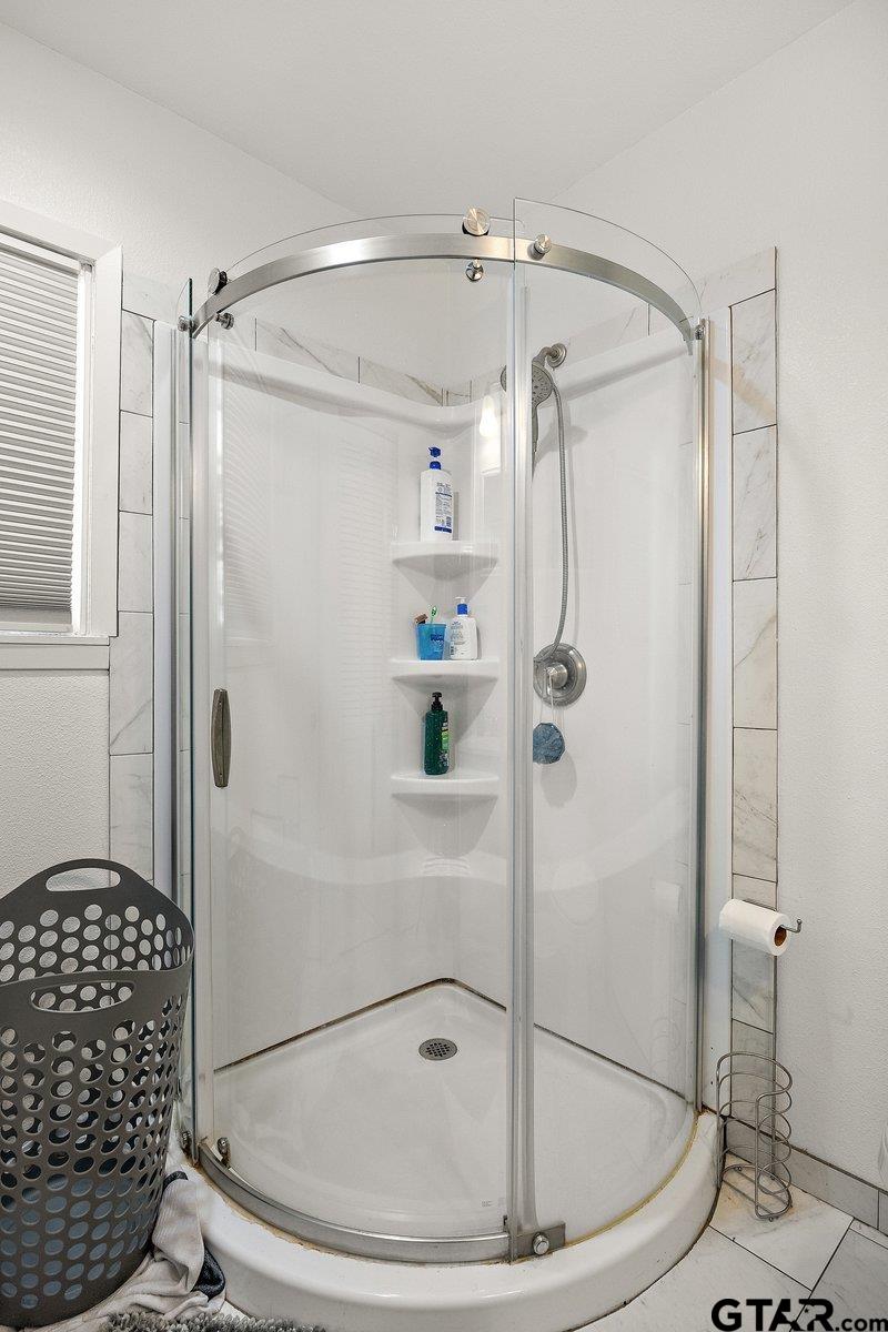 279 Fairview Street Rusk, TX 75785 - Photo 16 of 23 a bathroom that has a glass shower door