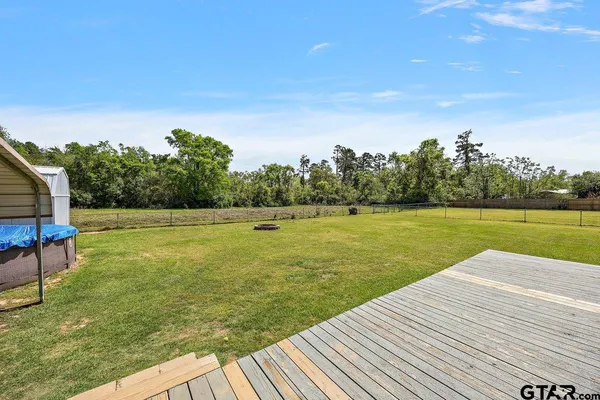 a view of a lake with a yard