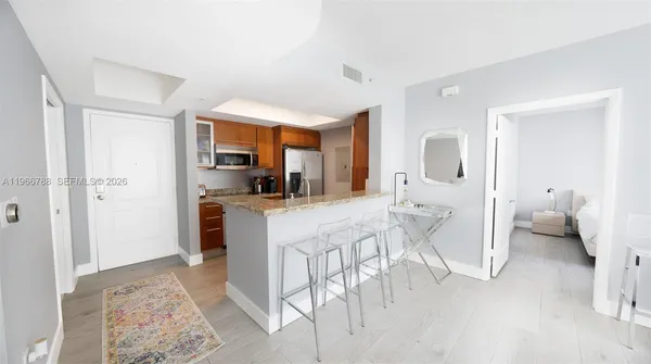 a living room with furniture and a rug