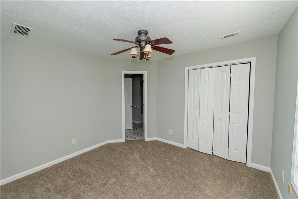 3440 Maple Valley Drive Cumming, GA 30040 - Photo 17 of 23 a view of a chandelier fan