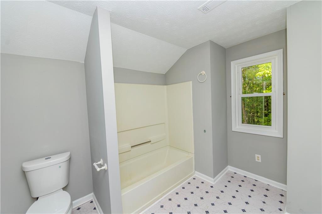 3440 Maple Valley Drive Cumming, GA 30040 - Photo 19 of 23 a bathroom with a toilet and a shower