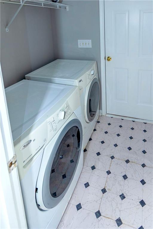 3440 Maple Valley Drive Cumming, GA 30040 - Photo 7 of 23 a utility room with dryer and washer