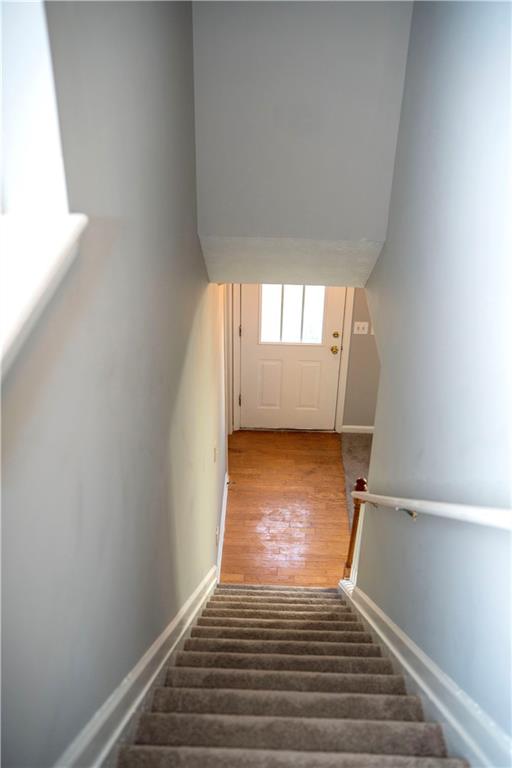 3440 Maple Valley Drive Cumming, GA 30040 - Photo 10 of 23 a view of a room with wooden floor and white walls