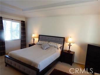 2 Los Palos Aliso Viejo, CA 92656 - Photo 14 of 32 a bedroom with a bed and a flat screen tv