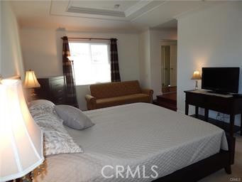 2 Los Palos Aliso Viejo, CA 92656 - Photo 15 of 32 a bedroom with a bed and a flat screen tv