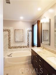 2 Los Palos Aliso Viejo, CA 92656 - Photo 16 of 32 a bathroom with a granite countertop tub sink and a mirror