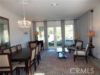 2 Los Palos Aliso Viejo, CA 92656 - Photo 2 of 32 a living room with furniture a lamp a rug and a chandelier