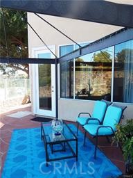 2 Los Palos Aliso Viejo, CA 92656 - Photo 22 of 32 a view of a patio with table and chairs with wooden floor and garden view