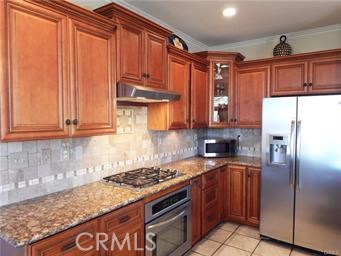 2 Los Palos Aliso Viejo, CA 92656 - Photo 5 of 32 a kitchen with stainless steel appliances granite countertop a refrigerator a sink and dishwasher
