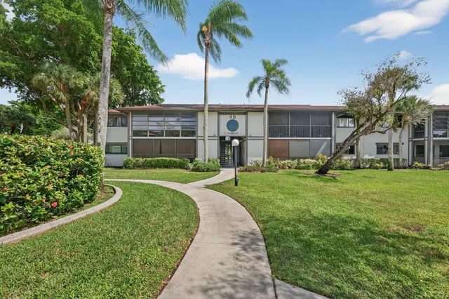 a view of a backyard with a garden and plants