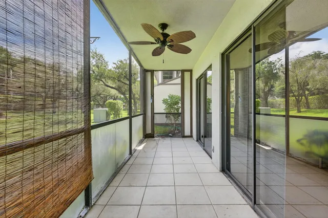a view of an entryway with a floor to ceiling window