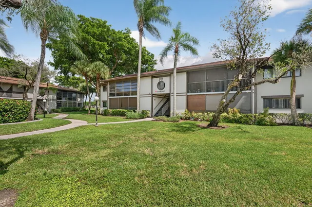 a view of a backyard with a garden and plants