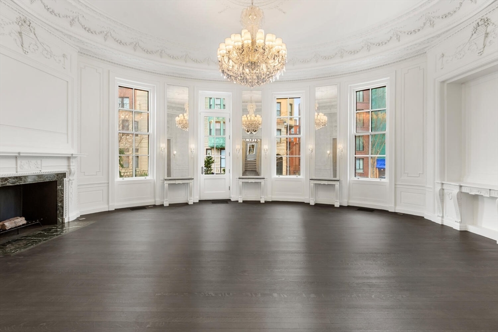 409 Commonwealth Avenue, Unit B Boston, MA 02215 - Photo 2 of 42 a view of an empty room with wooden floor and a window