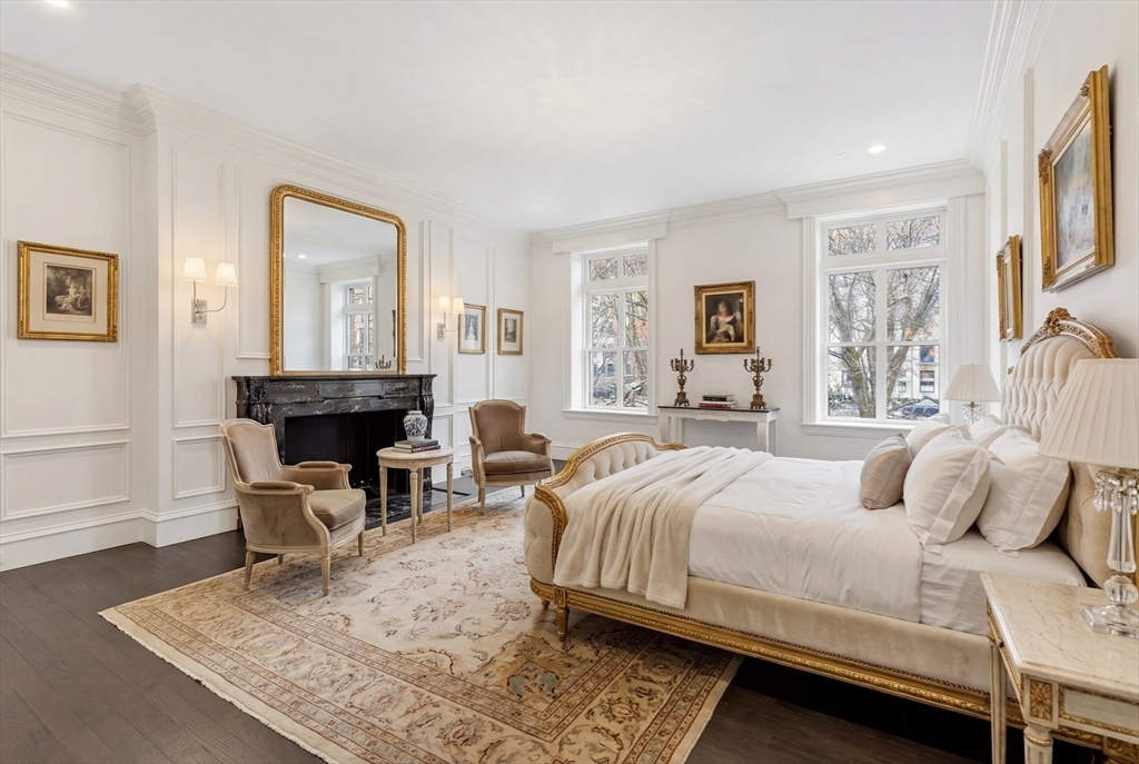 409 Commonwealth Avenue, Unit B Boston, MA 02215 - Photo 21 of 42 a bedroom with a bed and a fireplace