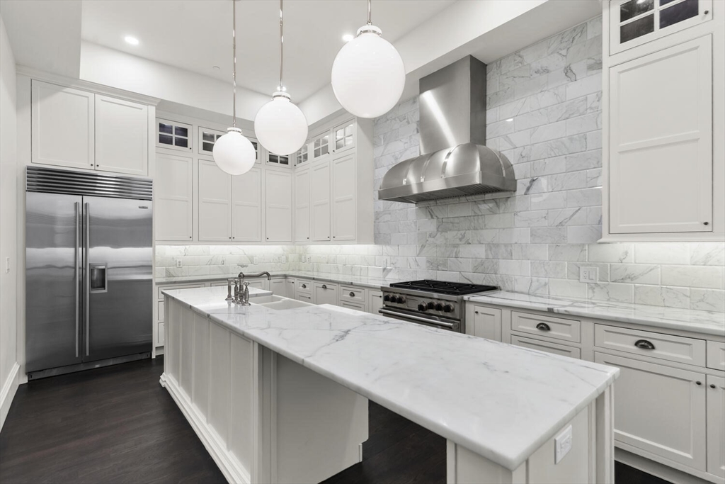 409 Commonwealth Avenue, Unit B Boston, MA 02215 - Photo 10 of 42 a kitchen with stainless steel appliances granite countertop a sink a stove and cabinets