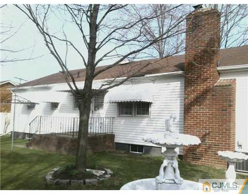 216 Cross Road Matawan, NJ 07747 - Photo 2 of 4 a front view of a house with garden