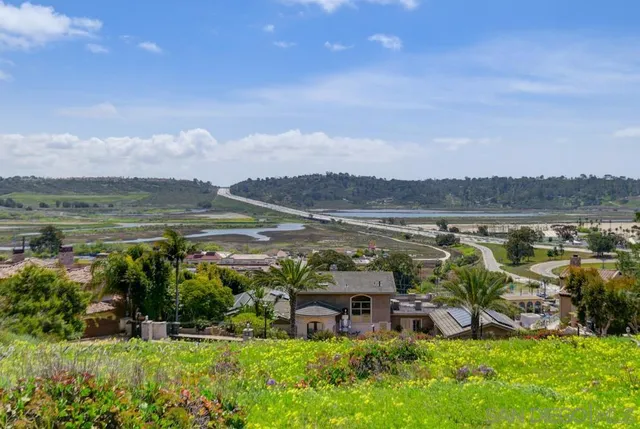 a view of a lake with houses with outdoor space