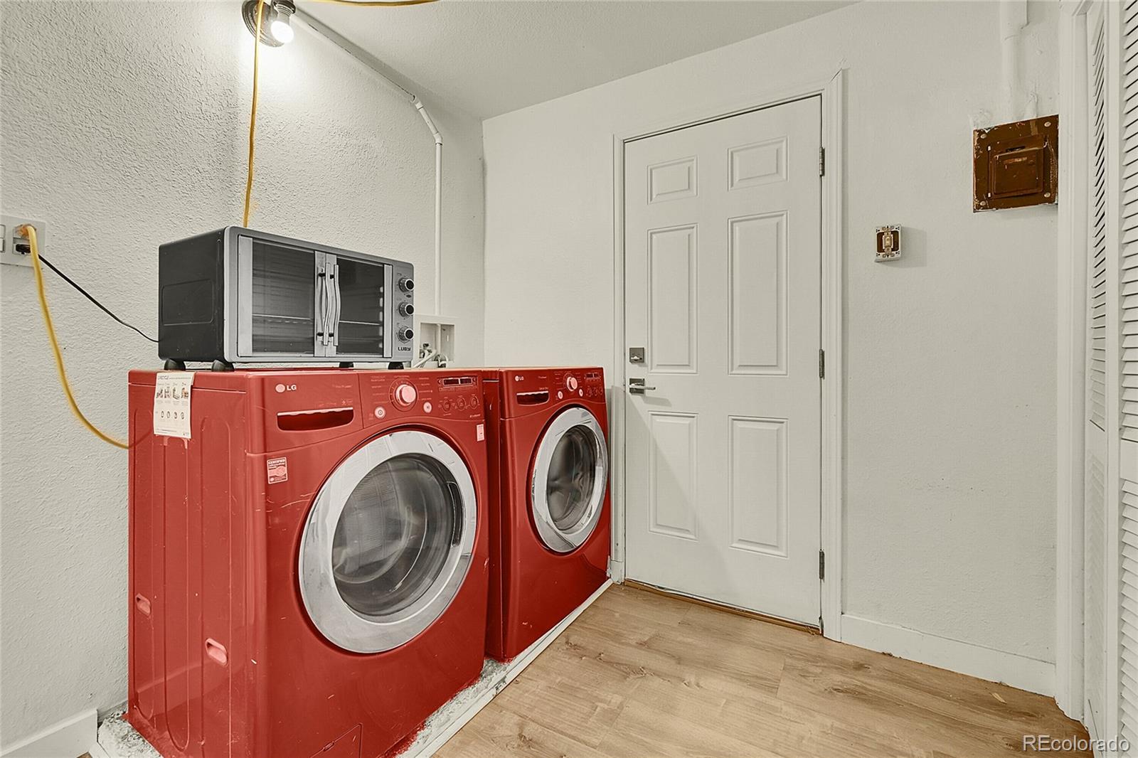 3011 Grape Street Denver, CO 80207 - Photo 11 of 42 a utility room with dryer and washer