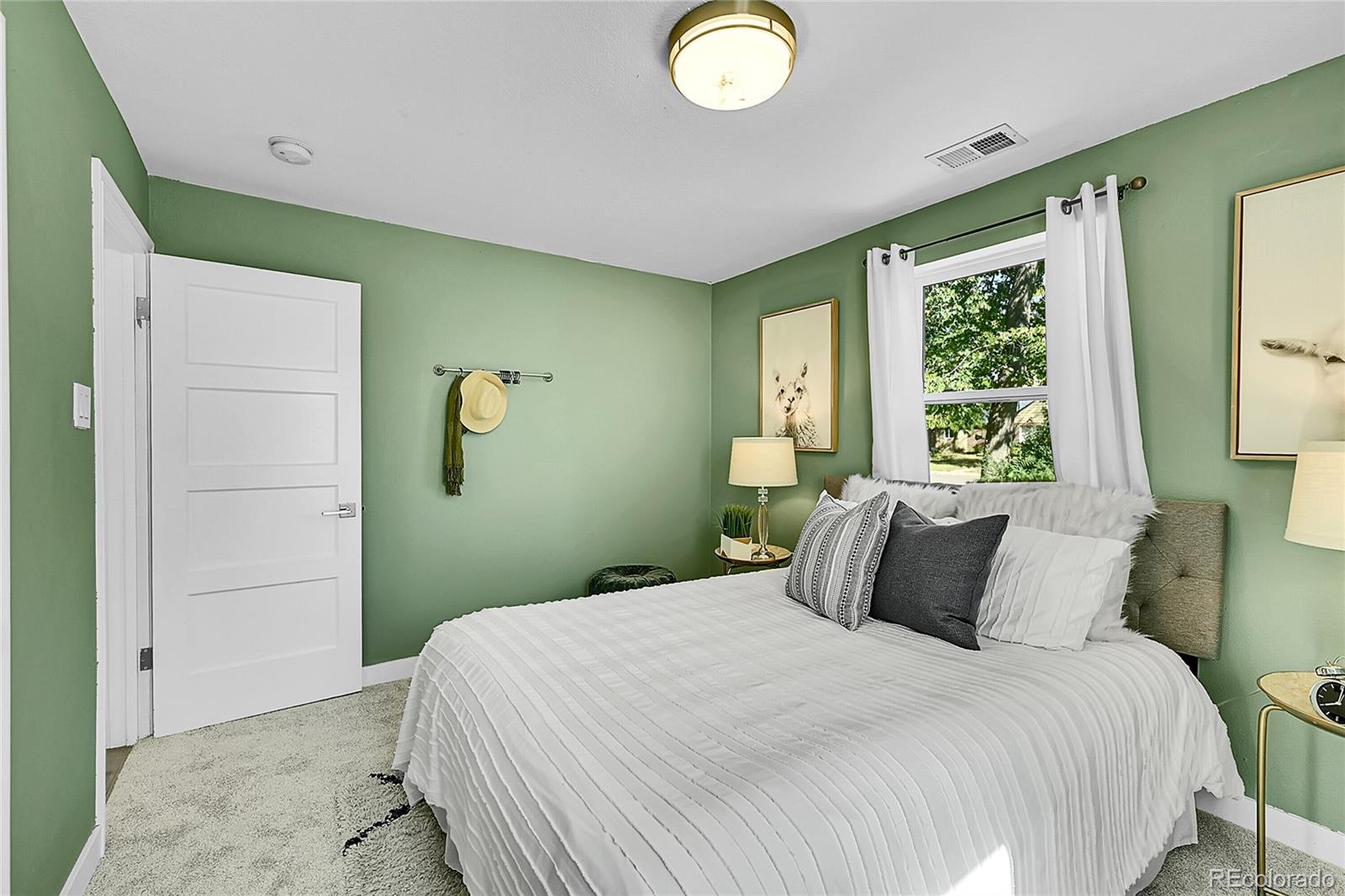 3011 Grape Street Denver, CO 80207 - Photo 13 of 42 a bedroom with a bed and a window