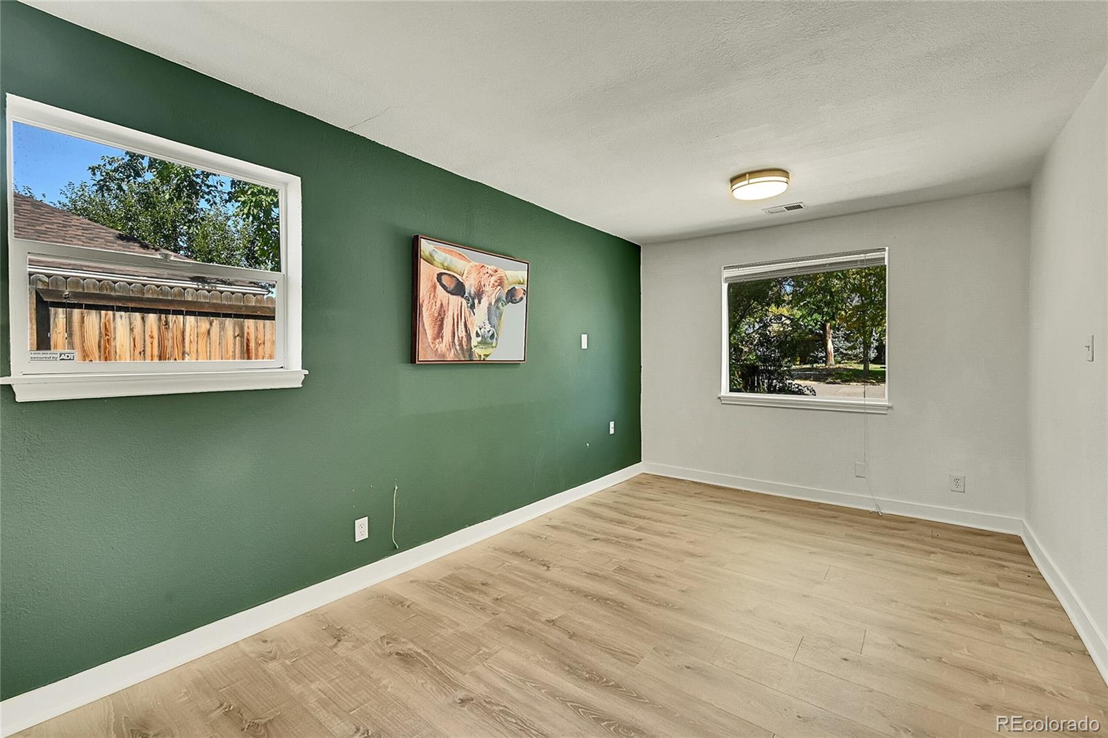 3011 Grape Street Denver, CO 80207 - Photo 18 of 42 a view of an empty room with a window