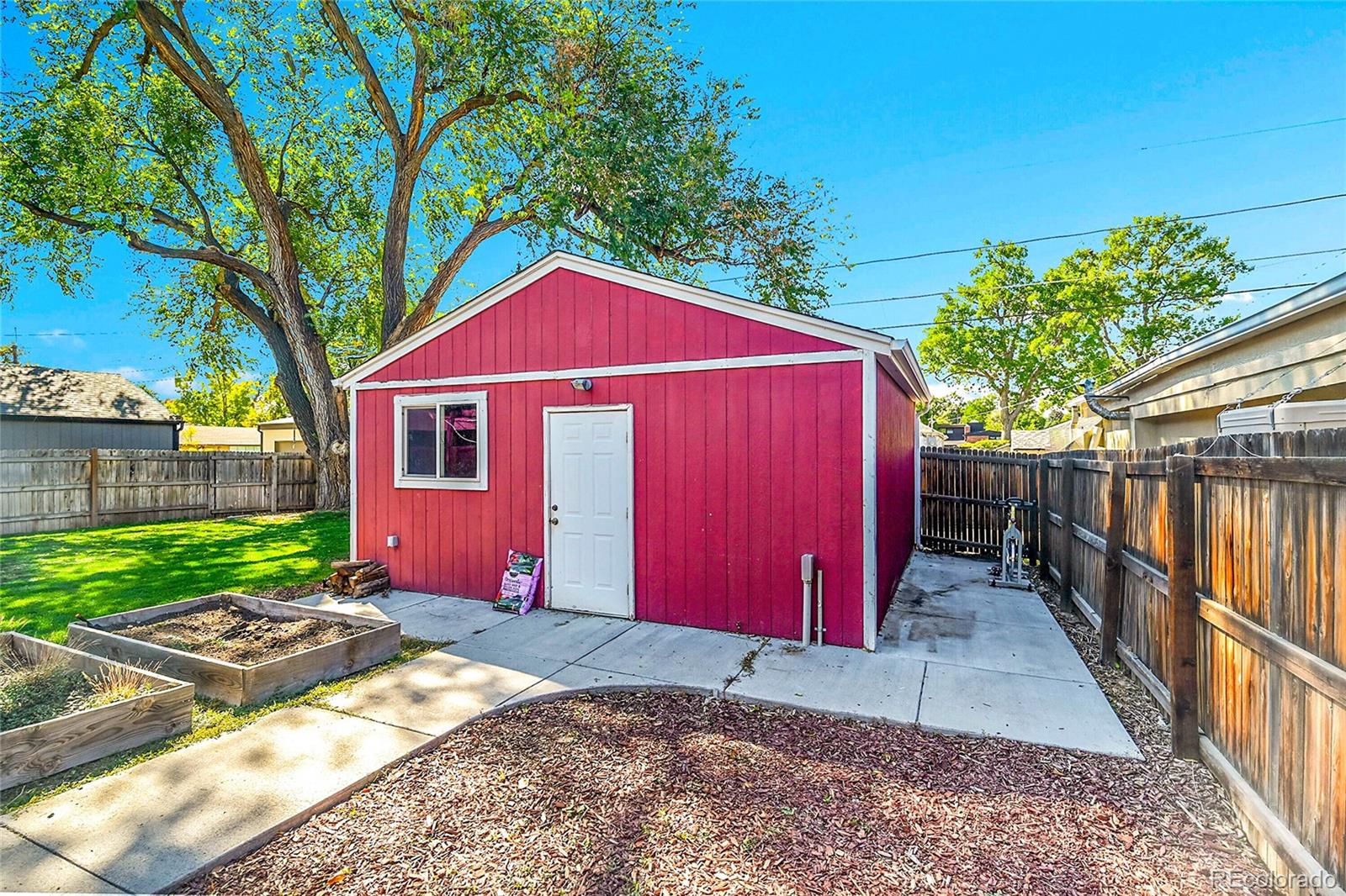 3011 Grape Street Denver, CO 80207 - Photo 26 of 42 a front view of a house with a yard