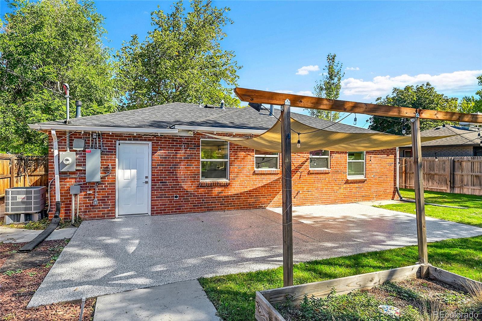 3011 Grape Street Denver, CO 80207 - Photo 29 of 42 a front view of a house with a garden