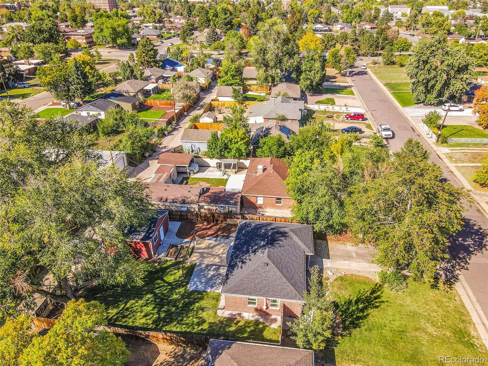 3011 Grape Street Denver, CO 80207 - Photo 34 of 42 an aerial view of residential houses with outdoor space and trees