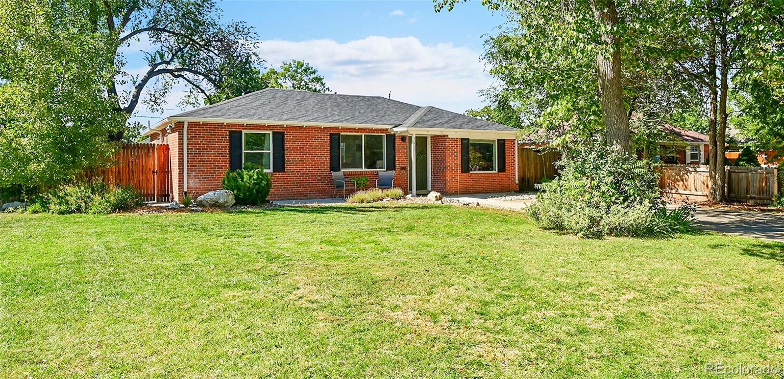3011 Grape Street Denver, CO 80207 - Photo 4 of 42 a front view of house with yard and green space