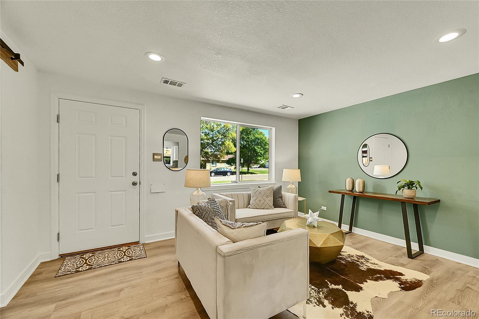3011 Grape Street Denver, CO 80207 - Photo 6 of 42 a living room with furniture and a window