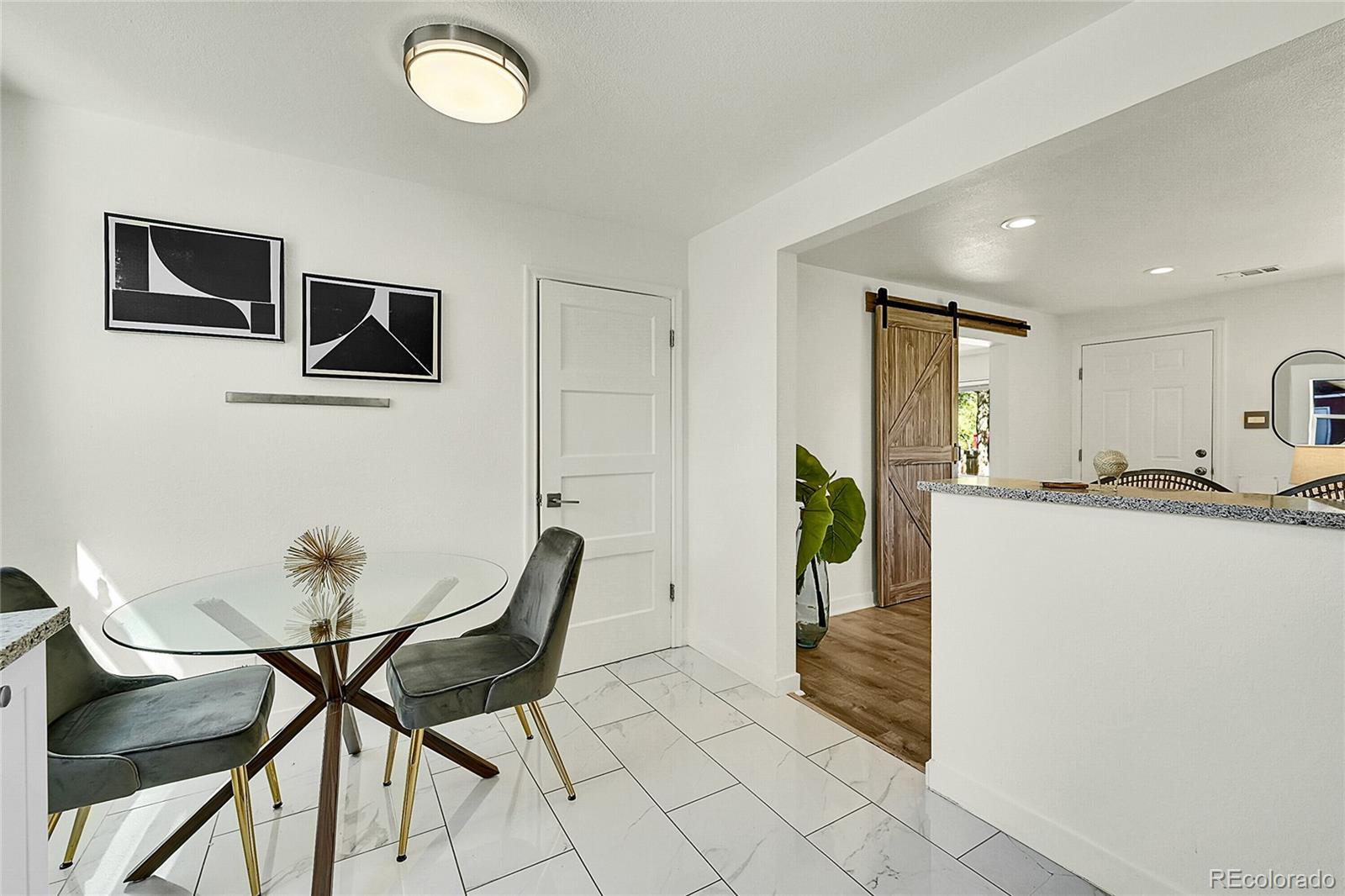 3011 Grape Street Denver, CO 80207 - Photo 9 of 42 a living room with furniture and a table