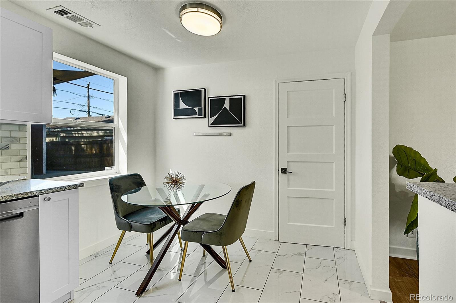 3011 Grape Street Denver, CO 80207 - Photo 10 of 42 a view of a livingroom with furniture and a flat screen tv