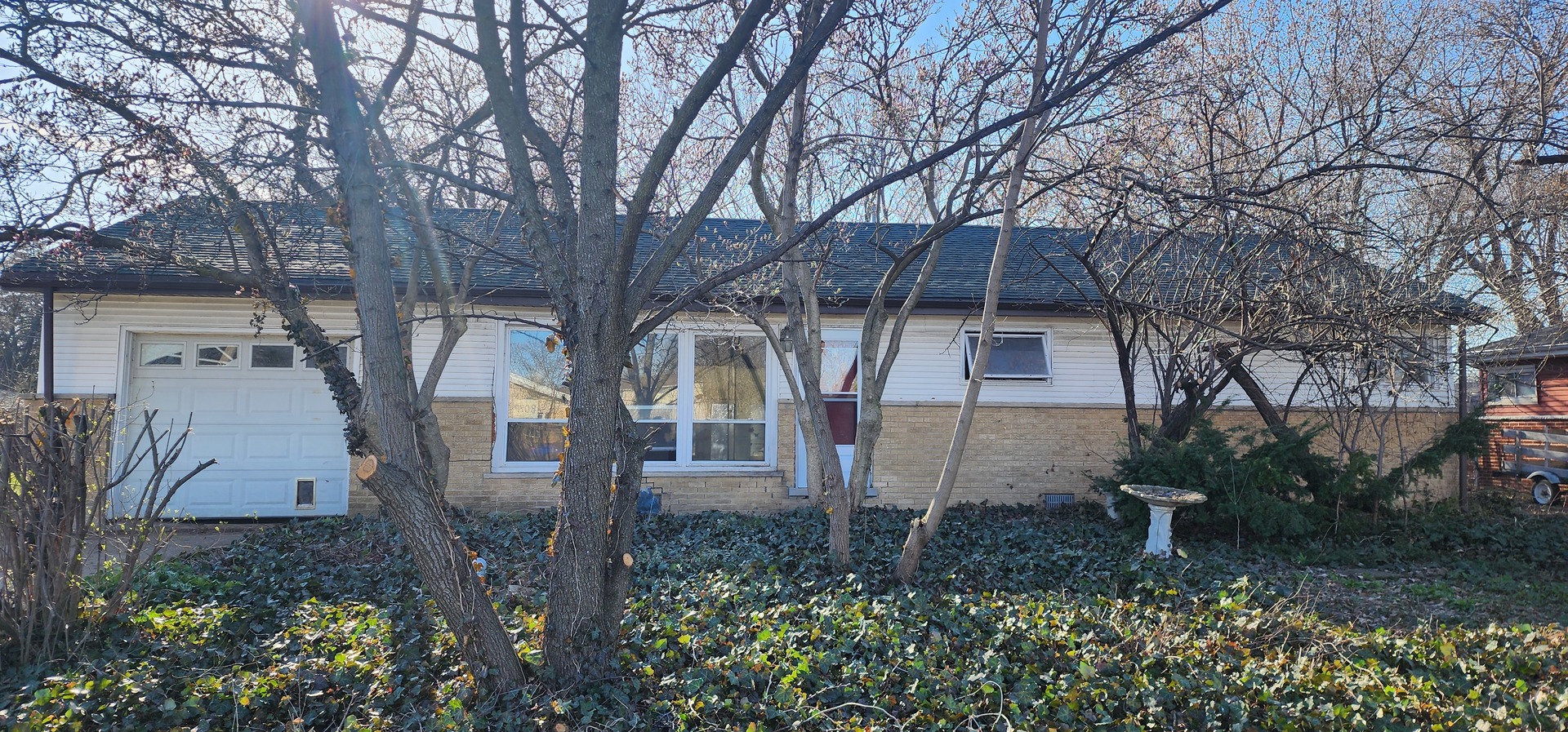 9408 Sumac Road Des Plaines, IL 60016 - Photo 1 of 2 a front view of a house with garden