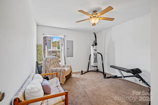 a room with furniture and white walls