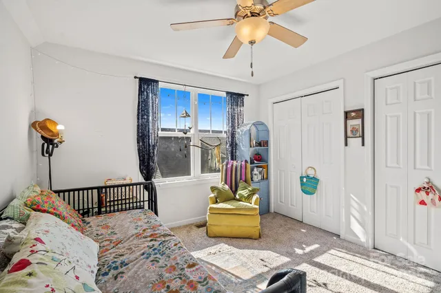 a bedroom with furniture and a window