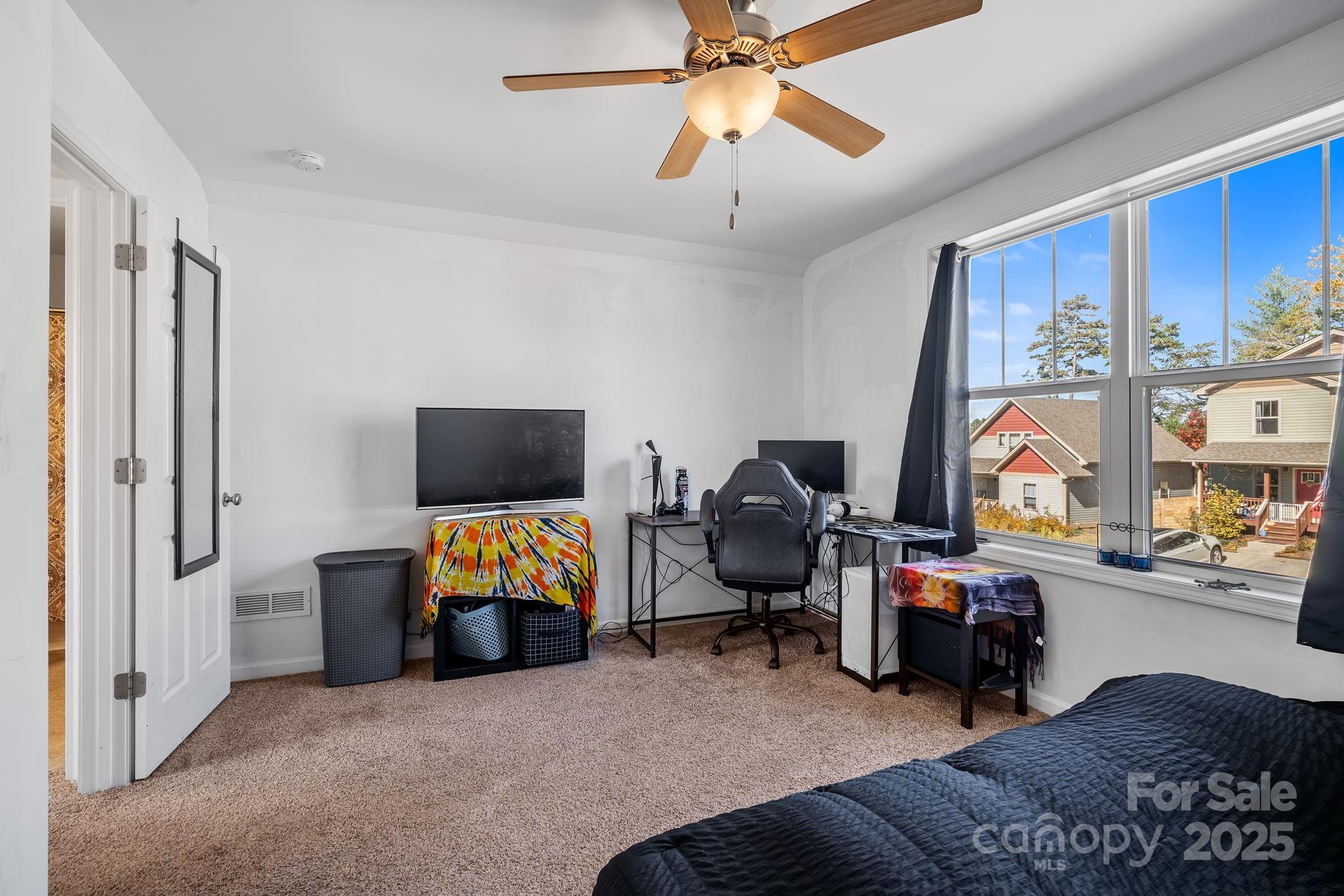 28 Yarrow Meadow Road Weaverville, NC 28787 - Photo 24 of 29 a living room with furniture and a flat screen tv