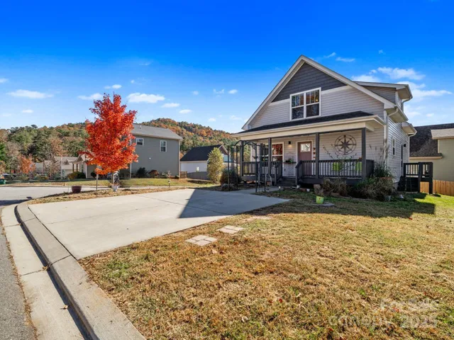 a front view of a house with yard and patio